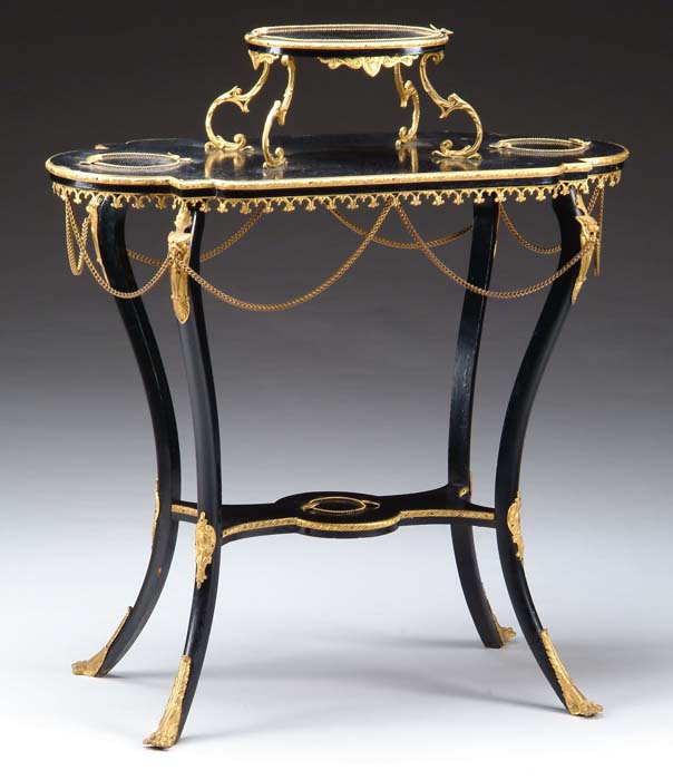 Appraisal: EBONIZED AND ORMOLU MOUNTED TIERED STAND Shaped top has footstool