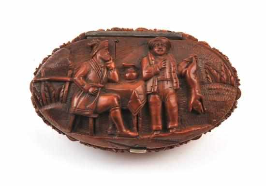 Appraisal: A French carved coquilla nut snuff box Circa The oval