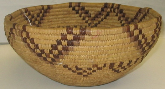 Appraisal: A NORTHWEST COILED INDIAN BASKET of cedar root rush and