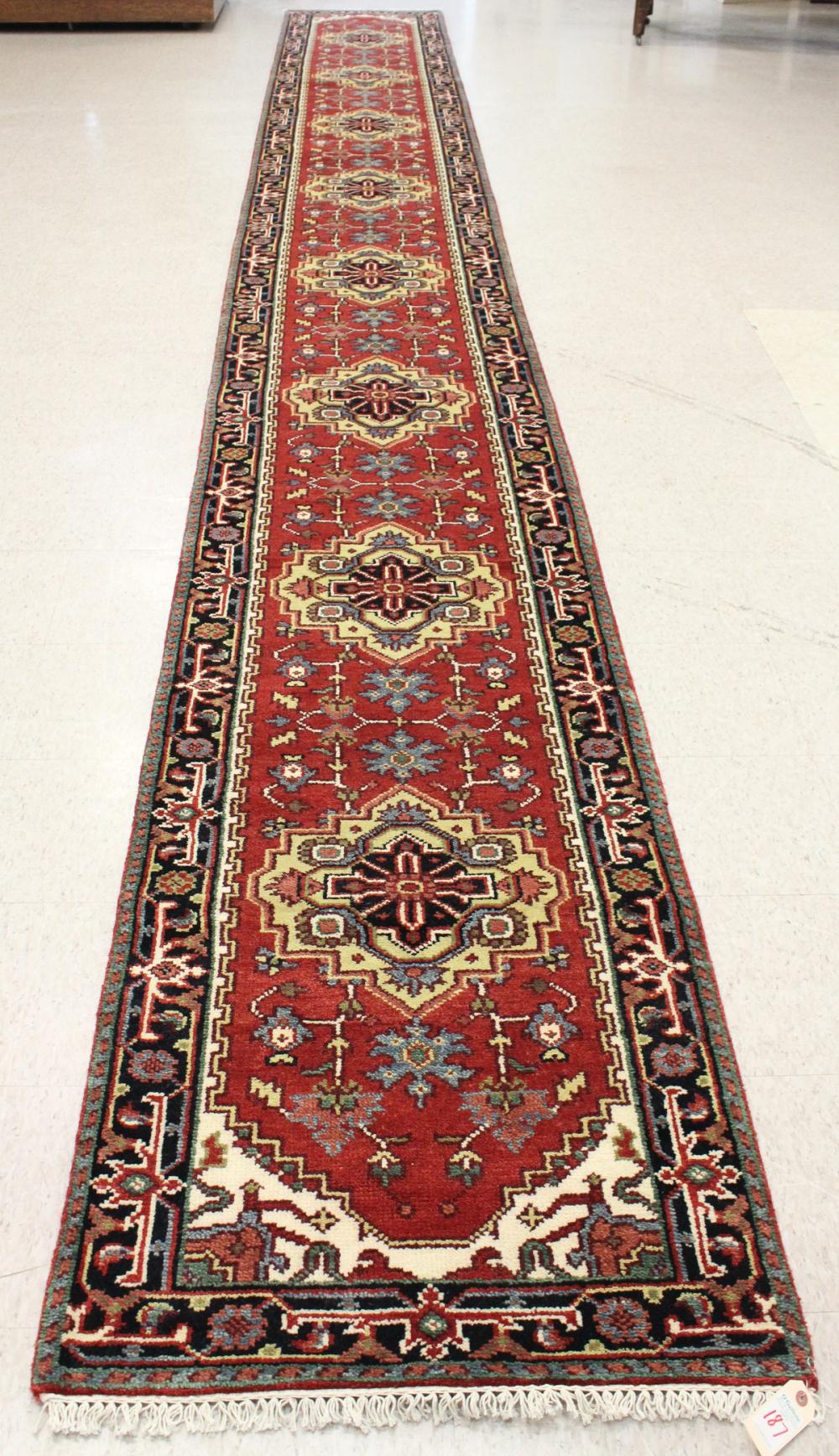 Appraisal: HAND KNOTTED ORIENTAL LONG RUG Persian Serab design featuring eight