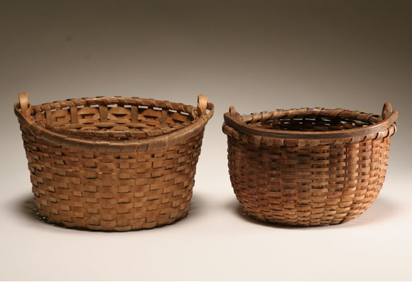 Appraisal: Two early splint gathering baskets with swing handles both hand