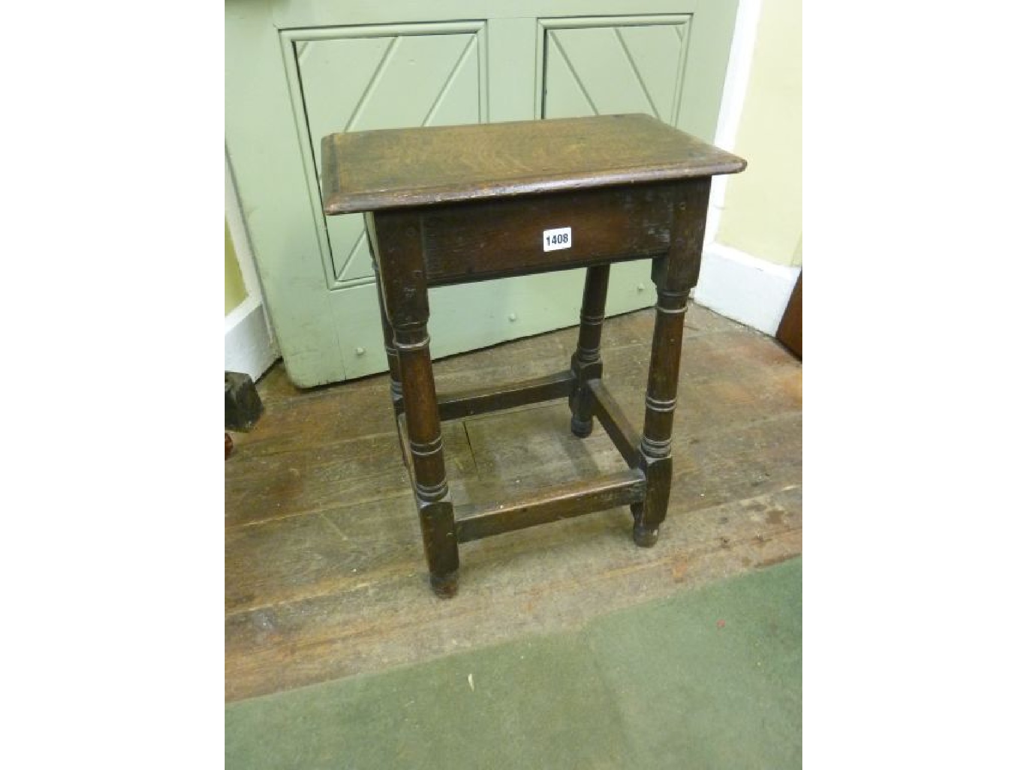 Appraisal: An th century oak coffin stool raised on four turned