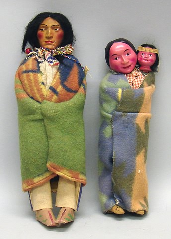 Appraisal: Pair of Native American dolls Skookum male Tape moccasins are