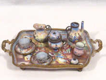 Appraisal: A Viennese enamel miniature coffee set comprising a coffee pot