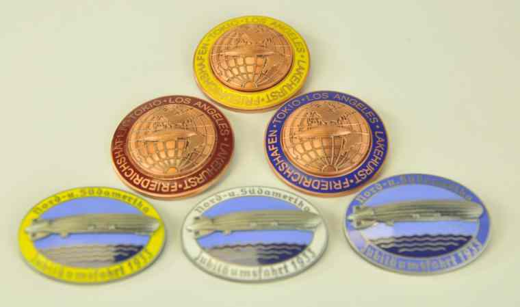 Appraisal: CONTEMPORARY GERMAN ENAMELED BADGES Very detailed replicas with Zeppelins depicted