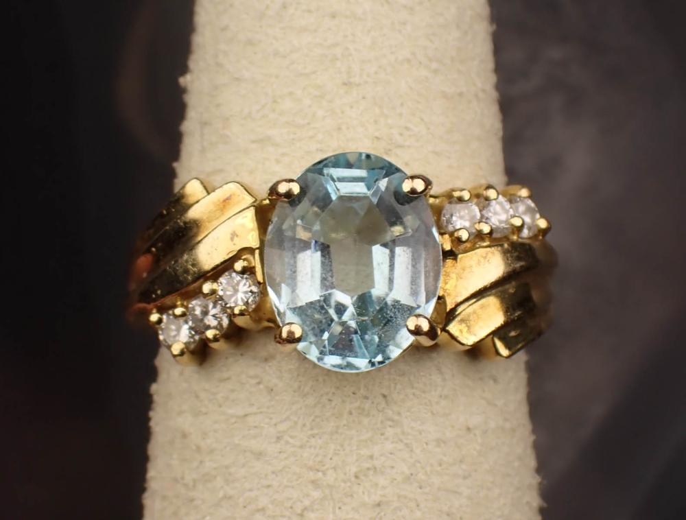 Appraisal: BLUE TOPAZ DIAMOND AND FOURTEEN KARAT GOLD RING The yellow