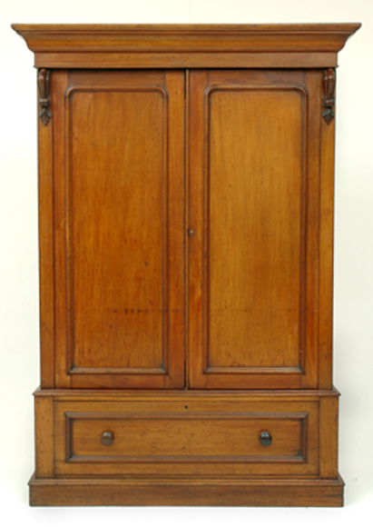 Appraisal: A VICTORIAN CEDAR WARDROBE The ogee pelmet above two panelled