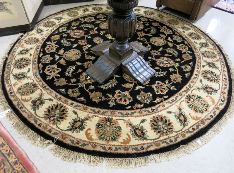 Appraisal: A ROUND ORIENTAL AREA RUG Indo-Persian having an overall floral