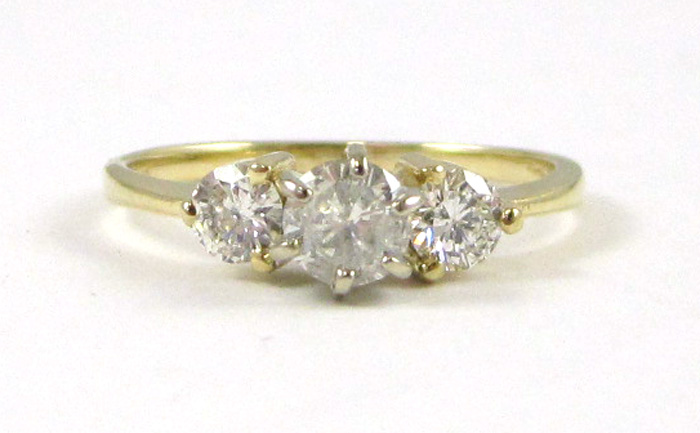 Appraisal: DIAMOND AND FOURTEEN KARAT GOLD RING set with three round