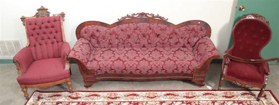 Appraisal: THREE PIECES OF VICTORIAN FURNITURE A mahogany veneered sofa with