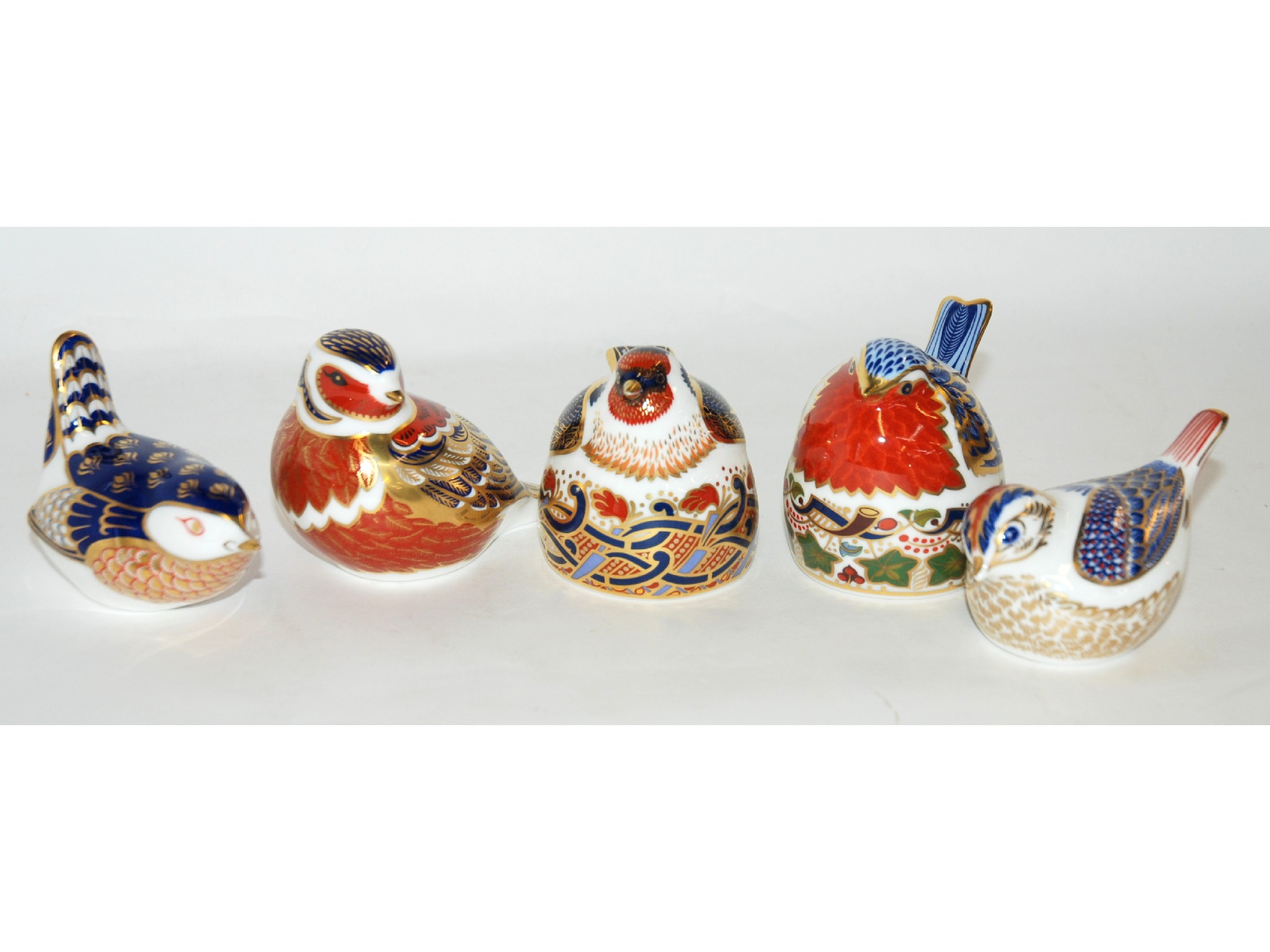 Appraisal: Five Royal Crown Derby paperweights including Robin Nesting Goldfinch Nesting