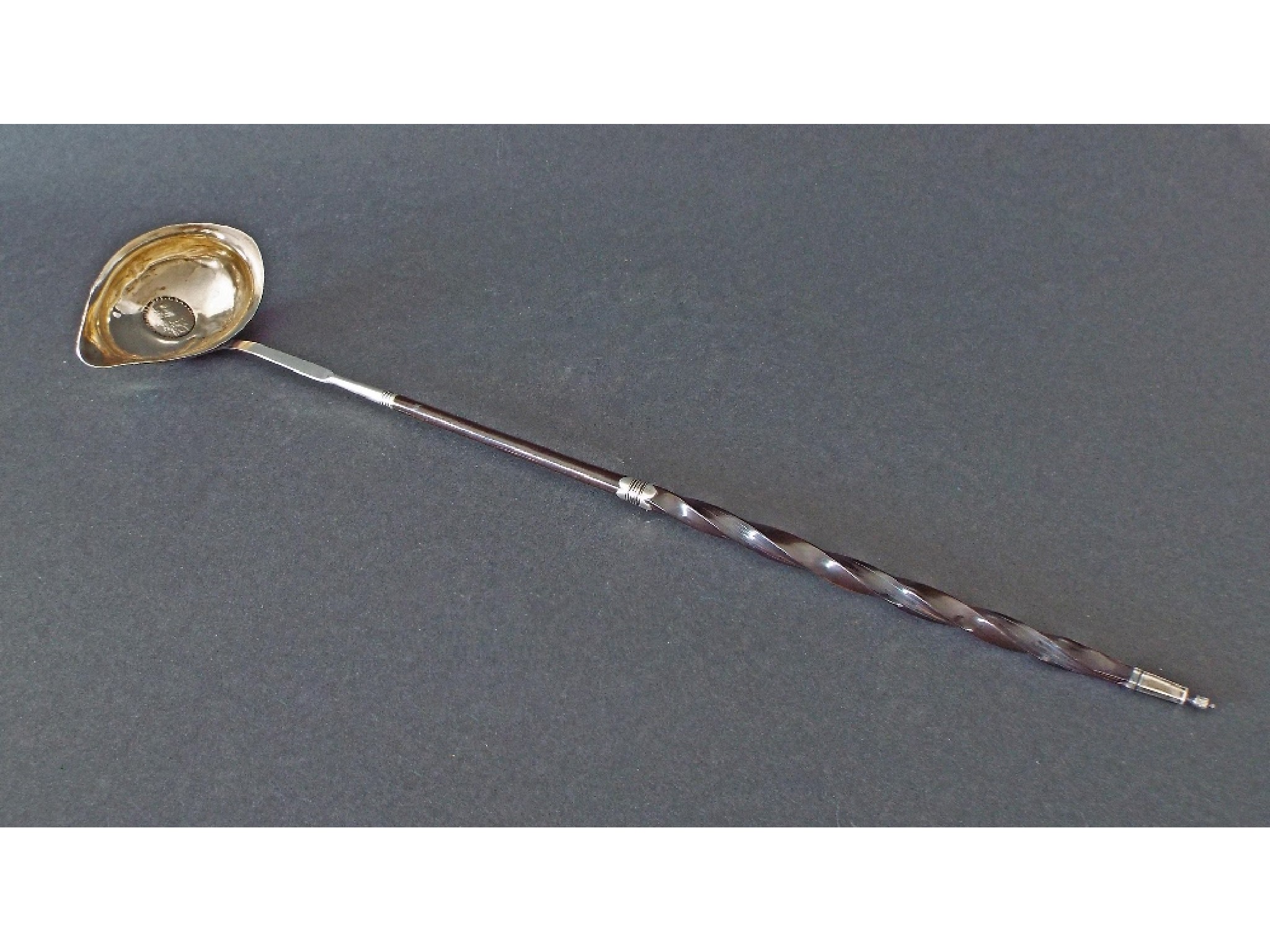 Appraisal: Georgian silver toddy ladle with barley twist horn handle the