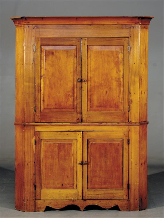 Appraisal: Southern walnut and cherry corner cabinet th centurycoved cornice with