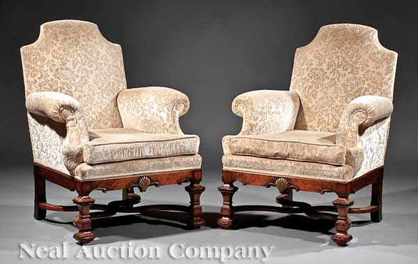 Appraisal: A Pair of Antique Walnut Library Armchairs shaped backs scroll