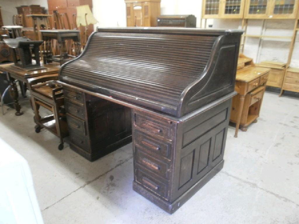 Appraisal: An oak roll top office desk