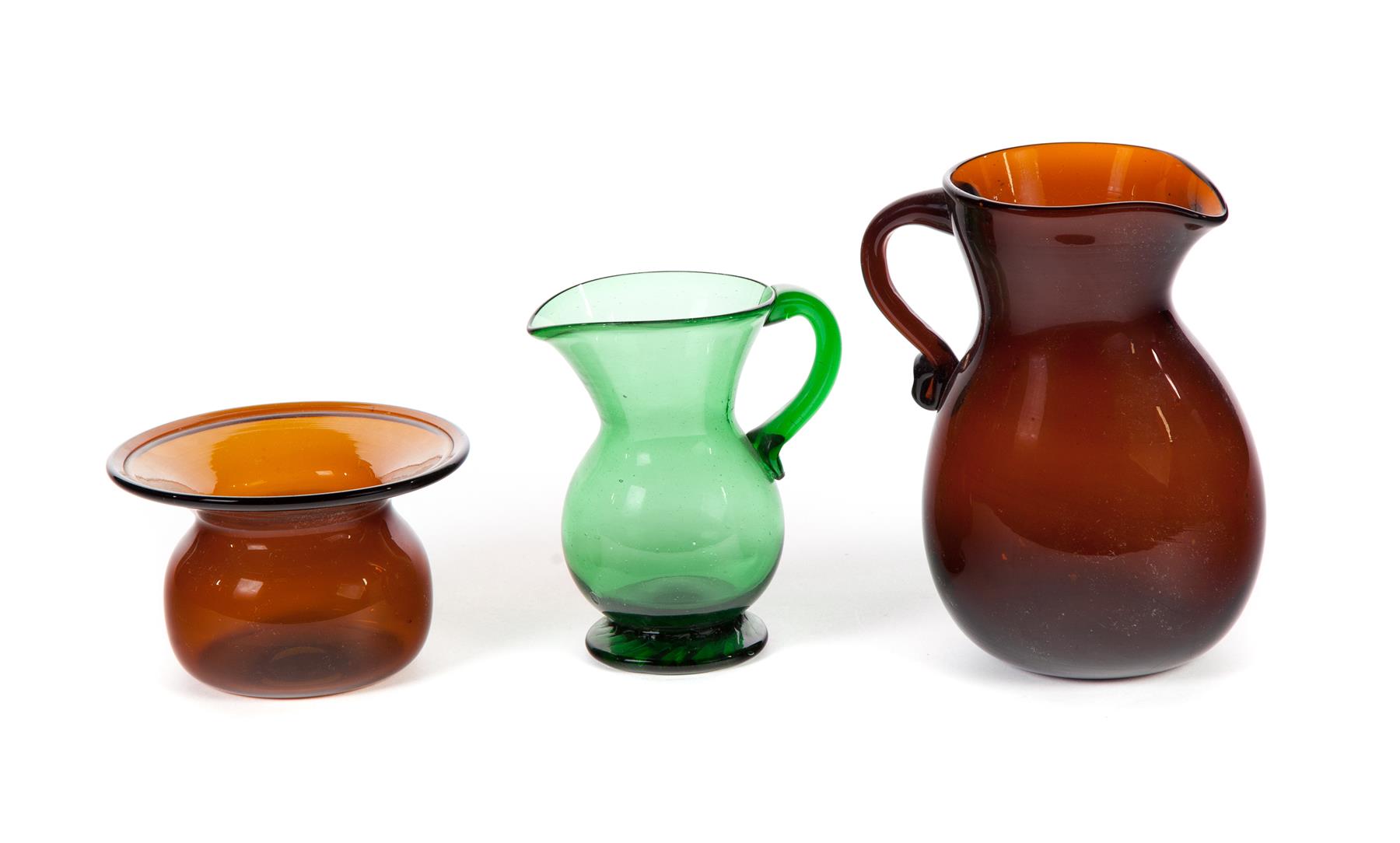 Appraisal: THREE PIECES OF AMERICAN BLOWN GLASS Nineteenth century Amber pitcher