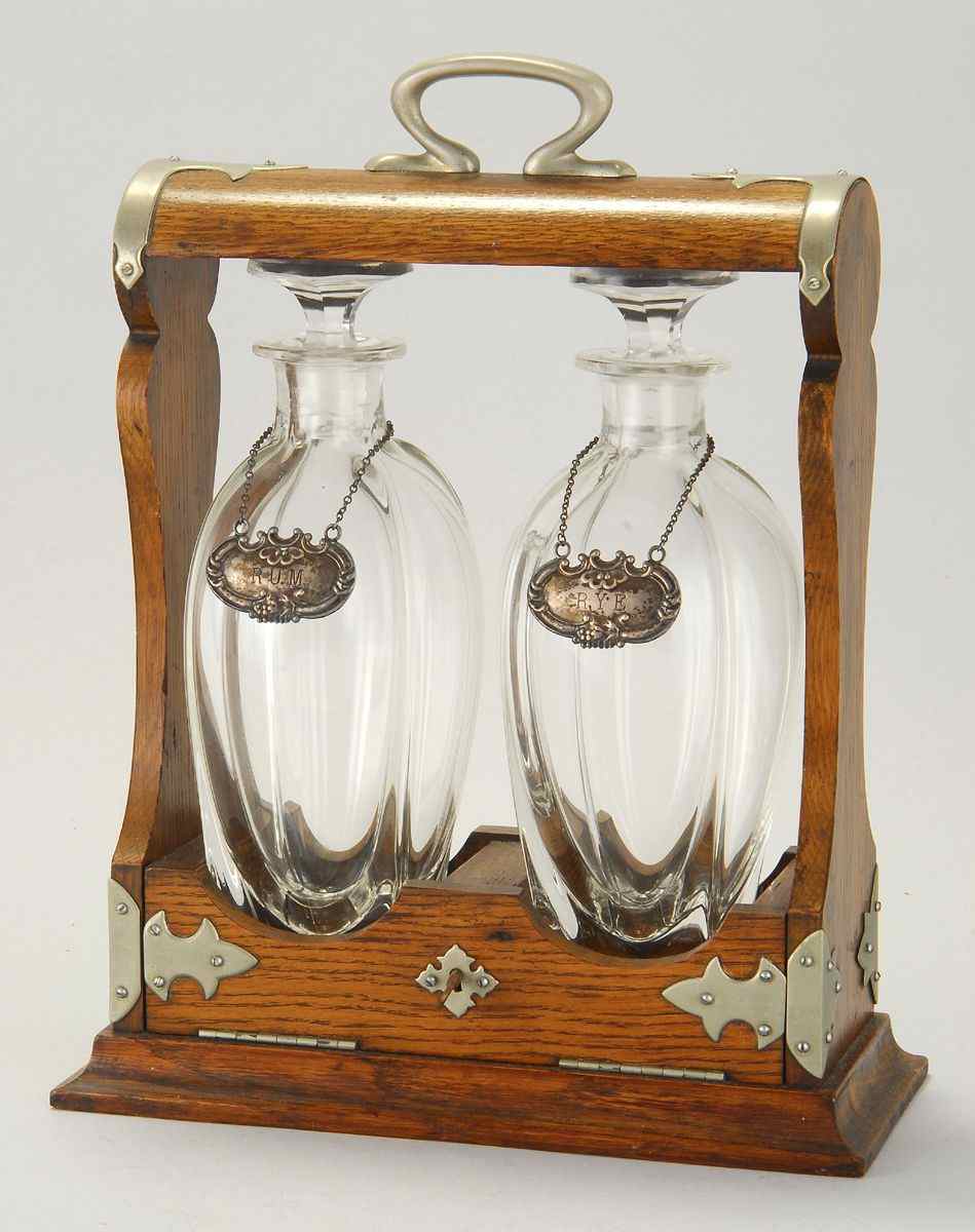 Appraisal: TANTALUSLate th CenturySilver plated and oak case with two crystal