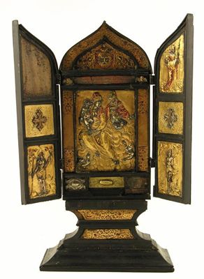 Appraisal: An ebony and gilt brass mounted table icon with a