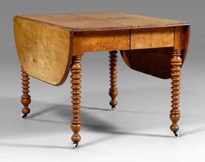 Appraisal: Tiger maple dining table two drop leaves and five additional