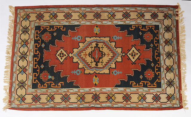 Appraisal: AN INDIAN KELIM STYLE RUG with geometric decoration and star