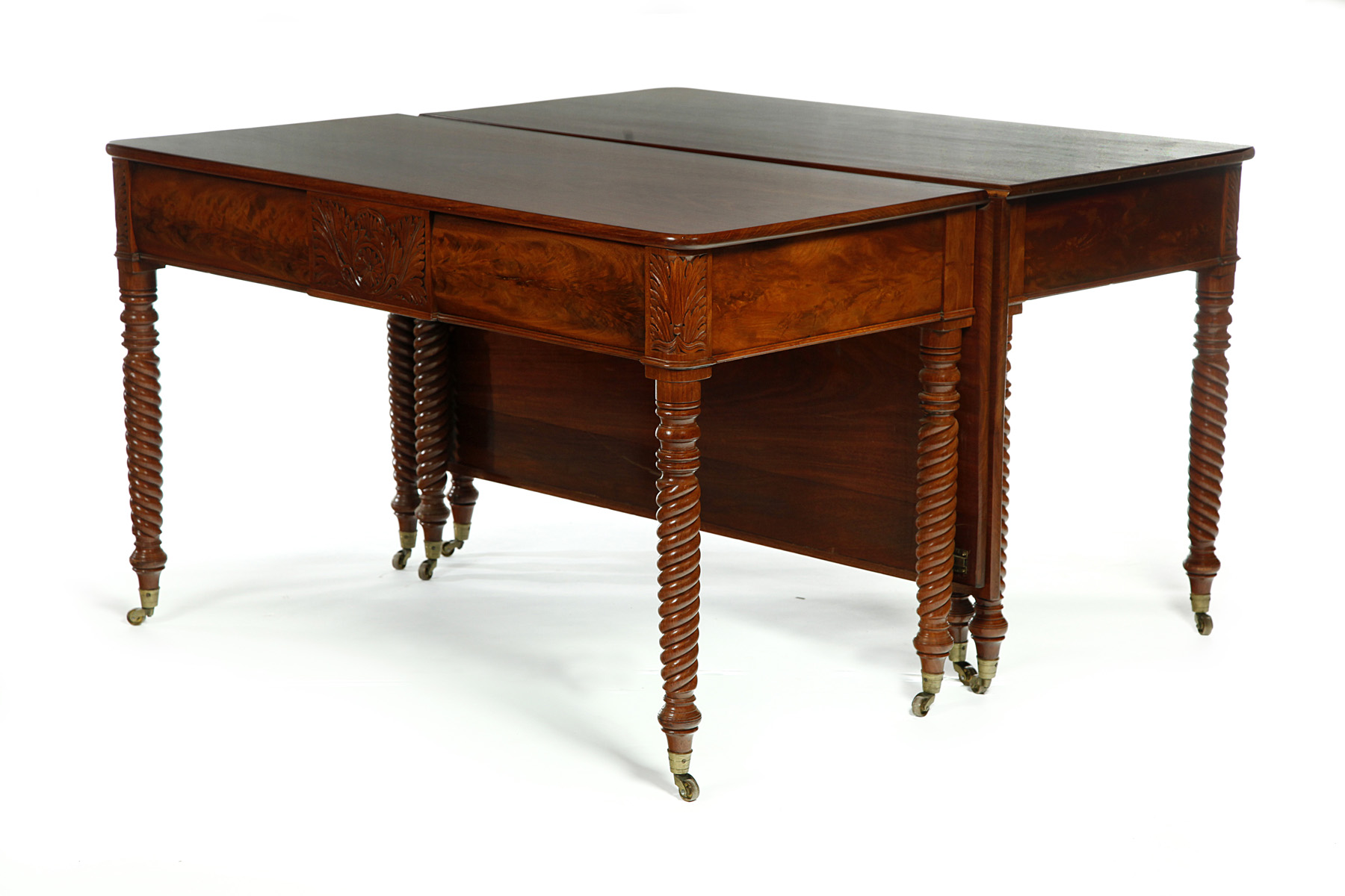 Appraisal: TWO-PART SHERATON DINING TABLE Ca mahogany Carved friezes and rope-turned