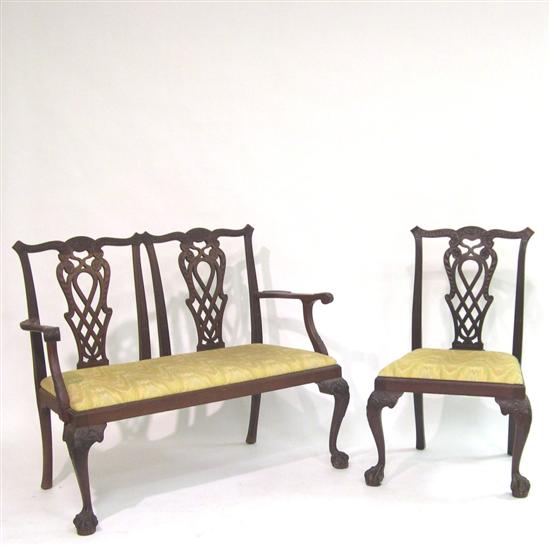 Appraisal: Chippendale style matching mahogany settee and side chair pierced splats