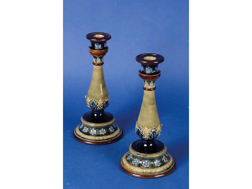 Appraisal: A PAIR OF DOULTON LAMBETH CANDLESTICKS in blue and green