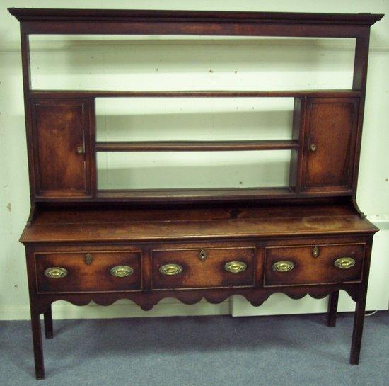 Appraisal: A th Century oak dresser the open rack with three