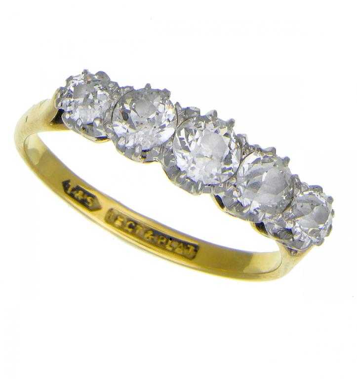 Appraisal: A DIAMOND FIVE-STONE RING with a graduated line of old