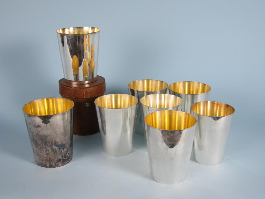 Appraisal: A set of eight Asprey's plated graduated Tumblers in pouch