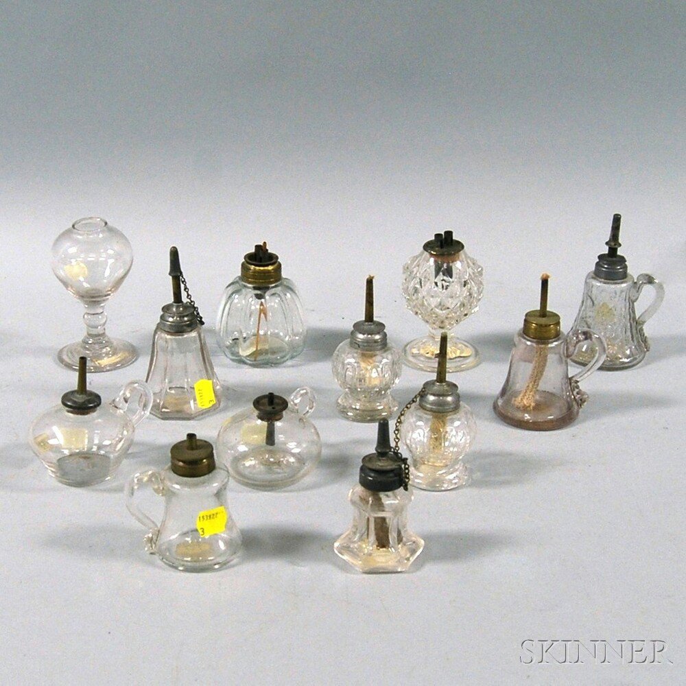 Appraisal: Twelve Colorless Blown and Pressed Glass Sparking and Hand Lamps