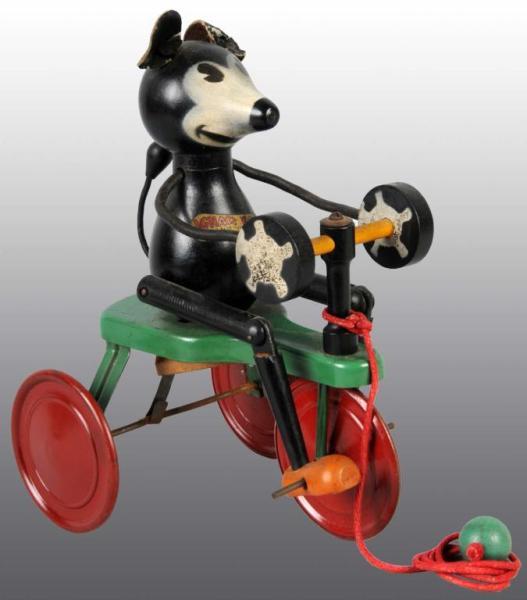 Appraisal: Wood Chein Ignatz Tricycle Pull Toy Description The figure of