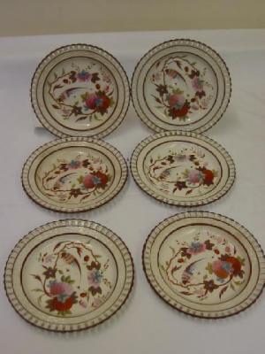 Appraisal: A SET OF SIX CREAMWARE PLATES with pierced wicker woven