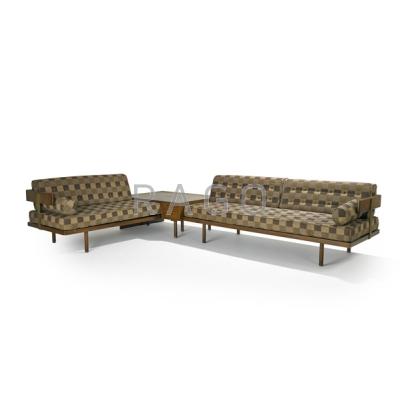 Appraisal: HARVEY PROBBER Sectional sofa USA s Mahogany brass and upholstery