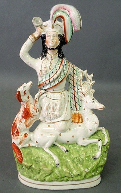 Appraisal: Staffordshire figure of a hunter kneeling on the back of