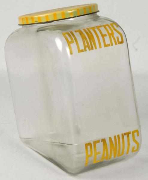 Appraisal: Planters Peanut Tall Slanted Jar with Lid Description Light soiling