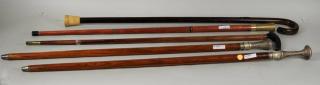 Appraisal: Five Brass Wood Canes Five brass and wood canes long