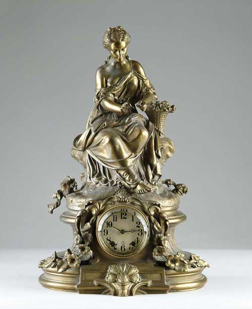 Appraisal: SETH THOMAS FIGURAL MANTEL CLOCK The bronze coated metal clock