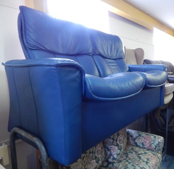 Appraisal: A modern blue leather two seat reclining sofa