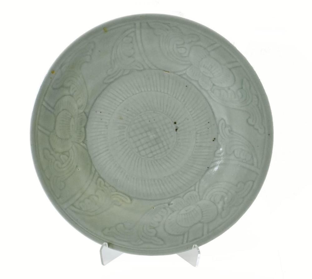 Appraisal: CHINESE FOLIATE INCISED CELADON PLATEThe wide rim decorated with flowerheads