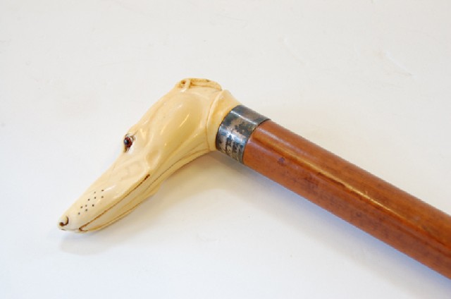 Appraisal: TH CENTURY WALKING CANE IVORY DOG HEAD HANDLE GLASS EYE