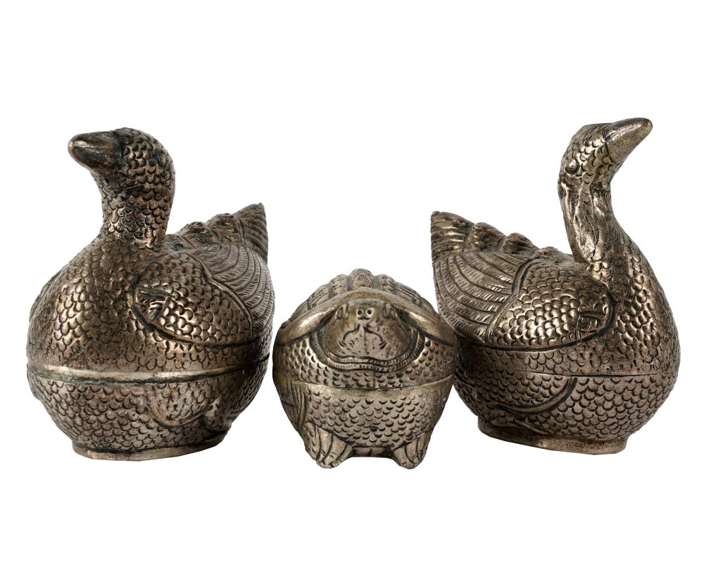 Appraisal: THREE CAMBODIAN SILVER ANIMAL-FORM BOXEScomprising two birds inches high and