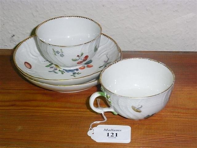 Appraisal: A PAIR OF MEISSEN TEACUPS AND SAUCERS relief moulded with