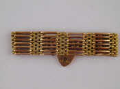 Appraisal: A two colour metal tests carat gold gate bracelet approx