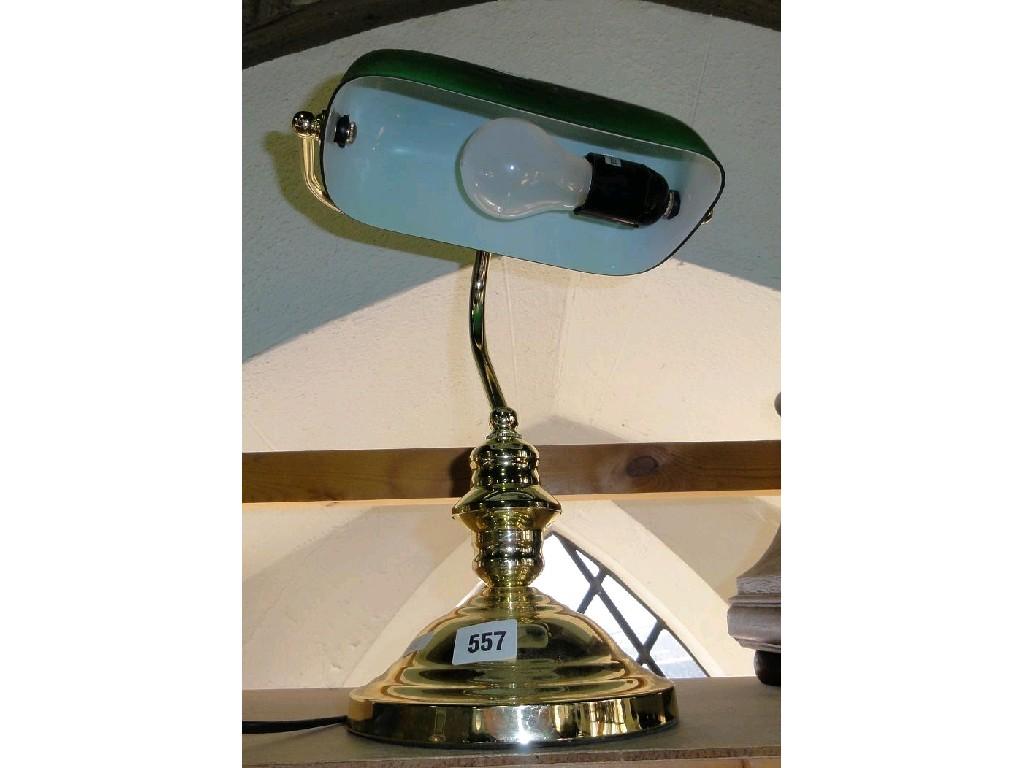 Appraisal: A gentlemans brass desk lamp with a green glass shade