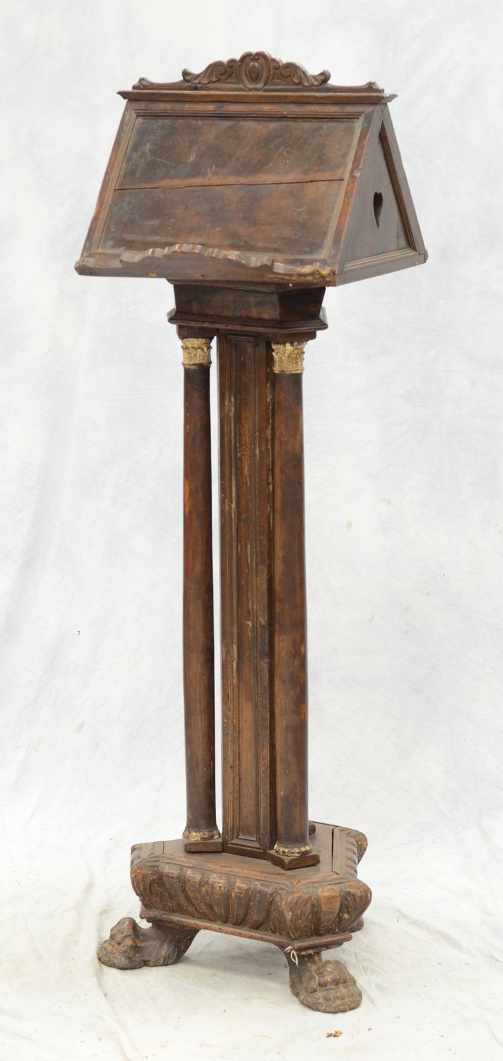 Appraisal: Continental carved walnut Bible stand each side of the revolving