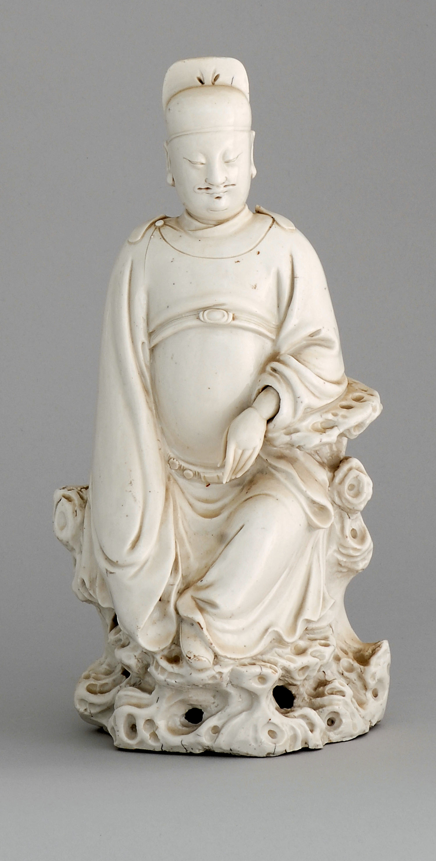 Appraisal: BLANC DE CHINE PORCELAIN FIGURE OF A MANDARIN th CenturySeated