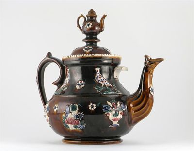 Appraisal: A bargeware teapot and cover sprigged with pheasants and bowls