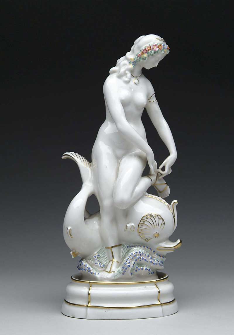 Appraisal: PORCELAIN GILT AND PAINTED FIGURE OF A NUDE MAIDEN WITH