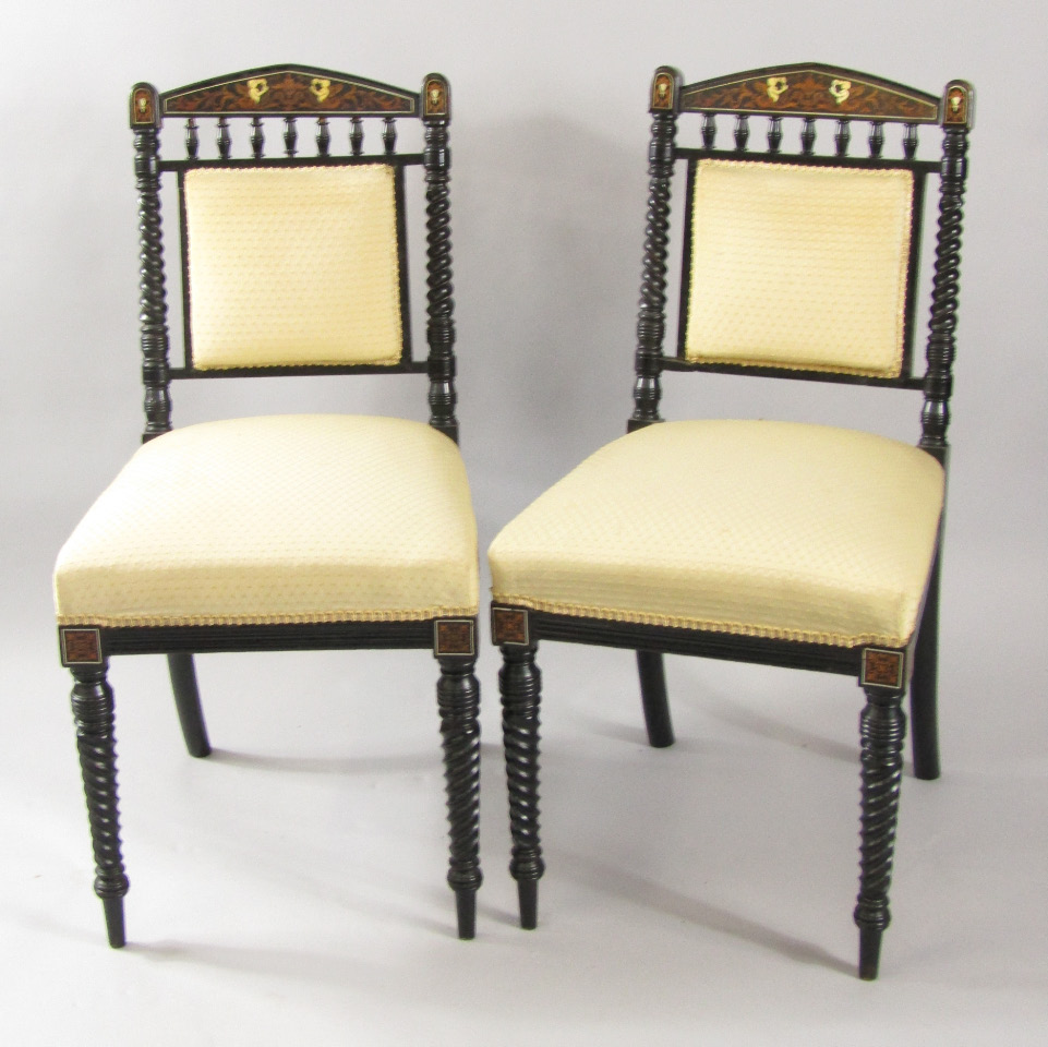 Appraisal: A pair of Victorian ebonised single dining chairs the crest